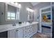 Bathroom featuring double sinks and a separate tub at 7409 Gilderstern Glen Ct, Huntersville, NC 28078