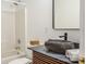 Modern bathroom with a unique stone sink, sleek fixtures, and neutral tones at 7409 Gilderstern Glen Ct, Huntersville, NC 28078