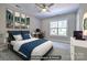Comfortable bedroom with a modern bed, stylish decor, and natural light at 7409 Gilderstern Glen Ct, Huntersville, NC 28078