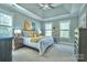 Spacious bedroom with a tray ceiling and lots of natural light at 7409 Gilderstern Glen Ct, Huntersville, NC 28078