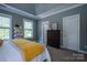 Comfortable bedroom featuring a large window and a dresser at 7409 Gilderstern Glen Ct, Huntersville, NC 28078