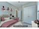 Cozy bedroom featuring a bed, small desk, and closet at 7409 Gilderstern Glen Ct, Huntersville, NC 28078