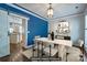 Bright dining room features a modern table set, pendant lighting, and an open view into the home's kitchen at 7409 Gilderstern Glen Ct, Huntersville, NC 28078