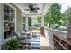 Relaxing front porch features comfortable seating, a stylish rug, and views of the neighborhood at 7409 Gilderstern Glen Ct, Huntersville, NC 28078