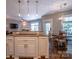 Bright kitchen featuring granite countertops, stainless steel appliances, and pendant lighting at 7409 Gilderstern Glen Ct, Huntersville, NC 28078