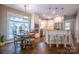 A stylish kitchen featuring stainless appliances, granite countertops and a breakfast nook at 7409 Gilderstern Glen Ct, Huntersville, NC 28078
