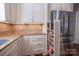Modern kitchen with granite countertops, stainless steel appliances, and custom cabinetry at 7409 Gilderstern Glen Ct, Huntersville, NC 28078