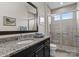 Bathroom with granite countertop, nice mirror, and walk-in glass shower at 767 Pinnacle Dr, Iron Station, NC 28080