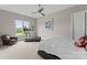 Large bedroom featuring comfortable queen-sized bed, a treadmill, and a ceiling fan at 767 Pinnacle Dr, Iron Station, NC 28080