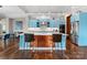 Well-designed kitchen featuring blue cabinets, stainless steel appliances, and a large kitchen island at 767 Pinnacle Dr, Iron Station, NC 28080
