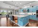 Charming kitchen with a center island, farmhouse sink, stainless appliances, and bright lighting at 767 Pinnacle Dr, Iron Station, NC 28080