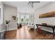 Bright and airy living room with multiple windows, stylish seating, and a decorative bookshelf at 767 Pinnacle Dr, Iron Station, NC 28080