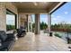 Expansive patio featuring multiple seating areas with views of the sparkling pool, greenery, and custom stonework at 767 Pinnacle Dr, Iron Station, NC 28080