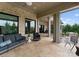 Charming patio with brick accents, comfortable seating, and an open view to the beautifully landscaped backyard at 767 Pinnacle Dr, Iron Station, NC 28080