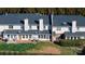 Aerial view showcases townhouse with patio, grass, landscaping, creating a serene residential setting at 825 21St Ne Ave, Hickory, NC 28601