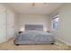 A bright bedroom features a gray bed, neutral walls, and soft carpet, creating a serene atmosphere at 825 21St Ne Ave, Hickory, NC 28601