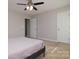 A bedroom features carpet and neutral walls, providing a tranquil space with natural light and ceiling fan at 825 21St Ne Ave, Hickory, NC 28601