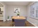 Bright dining room with table, chairs, laminate flooring, and neutral paint at 825 21St Ne Ave, Hickory, NC 28601