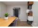 Dining room with laminate flooring, decorative shelving, and adjacent entrance and foyer at 825 21St Ne Ave, Hickory, NC 28601