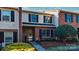 Inviting townhouse front with brick and beige siding, manicured bushes, enhancing curb appeal at 825 21St Ne Ave, Hickory, NC 28601