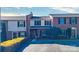 Townhouse front with brick and beige siding, complemented by green bushes, enhancing curb appeal at 825 21St Ne Ave, Hickory, NC 28601