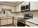 Functional kitchen featuring stainless steel appliances and light countertops at 825 21St Ne Ave, Hickory, NC 28601