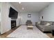 Beautiful living room with a fireplace, large tv and gray sofa at 825 21St Ne Ave, Hickory, NC 28601