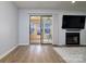 Bright living room with sliding glass doors to screened patio and hardwood floor at 825 21St Ne Ave, Hickory, NC 28601