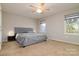 Inviting bedroom with ceiling fan and natural light from two windows at 825 21St Ne Ave, Hickory, NC 28601