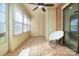 Relaxing sunroom with brick floors, multiple windows, and door to outside, perfect for enjoying the sunlight at 825 21St Ne Ave, Hickory, NC 28601