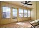 An inviting sunroom with brick floors, multiple windows, and a comfortable chair creates a relaxing space at 825 21St Ne Ave, Hickory, NC 28601