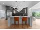 Contemporary kitchen with a large island, stainless steel appliances, and modern accents at 974 Queens Rd, Charlotte, NC 28207