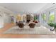 Spacious living room with hardwood floors and modern decor, featuring a walkout balcony at 974 Queens Rd, Charlotte, NC 28207