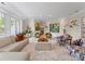 Bright living room featuring stylish furniture and natural light from large windows at 974 Queens Rd, Charlotte, NC 28207