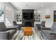 Modern living room with a striking fireplace, ample seating, and a stylish rug at 974 Queens Rd, Charlotte, NC 28207