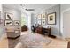 Bright office space featuring hardwood floors, custom desk, and ample natural light at 974 Queens Rd, Charlotte, NC 28207