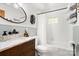 Bathroom with white subway tiles, elegant fixtures, and a marble-topped vanity at 10139 Arlington Church Rd, Mint Hill, NC 28227