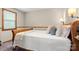 Bedroom with wood trim, plush pillows and a white bedspread at 10139 Arlington Church Rd, Mint Hill, NC 28227