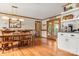 Elegant dining room featuring hardwood floors, classic chandelier, and a view of the outdoors at 10139 Arlington Church Rd, Mint Hill, NC 28227