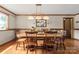 Hardwood dining room with traditional wooden table and chairs and lots of natural light at 10139 Arlington Church Rd, Mint Hill, NC 28227