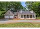 Charming traditional home with a welcoming front porch and a two-car attached garage at 10139 Arlington Church Rd, Mint Hill, NC 28227