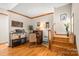 Cozy home office space with hardwood floors and classic wooden desk near the wooden stairs at 10139 Arlington Church Rd, Mint Hill, NC 28227