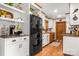 Bright kitchen featuring white cabinets, stainless steel appliances, and hardwood floors at 10139 Arlington Church Rd, Mint Hill, NC 28227
