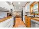 Modern kitchen featuring custom cabinets, wood countertops, and stainless steel appliances at 10139 Arlington Church Rd, Mint Hill, NC 28227