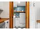 Convenient laundry room with modern appliances and storage, adjacent to kitchen at 10139 Arlington Church Rd, Mint Hill, NC 28227