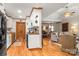 Spacious open-concept living room and kitchen featuring hardwood floors and natural light at 10139 Arlington Church Rd, Mint Hill, NC 28227