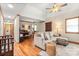 Spacious living room with hardwood floors, ceiling fan and neutral tones perfect for relaxation at 10139 Arlington Church Rd, Mint Hill, NC 28227