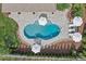 Aerial view of a private backyard oasis featuring a sparkling pool and lush landscaping at 106 Wrangler Dr, Mooresville, NC 28115
