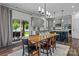 Open dining area with kitchen view and outdoor patio access, perfect for entertaining at 106 Wrangler Dr, Mooresville, NC 28115