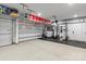 Spacious garage with ample storage, work-out equipment, and durable epoxy flooring at 106 Wrangler Dr, Mooresville, NC 28115